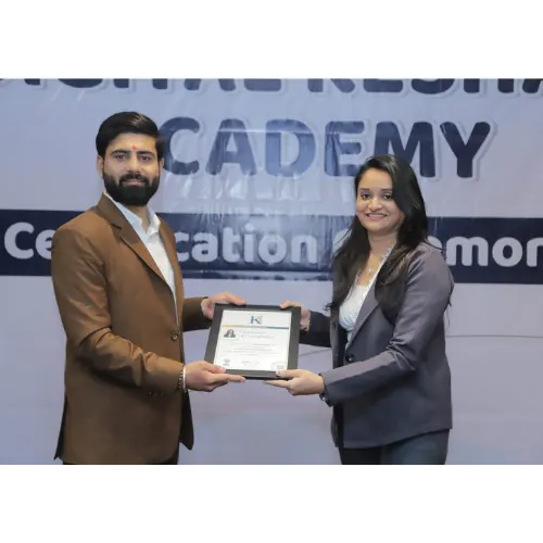 Two individuals exchange a certificate at a professional event, standing in front of a banner for a digital marketing institute in Surat, celebrating completion of a digital marketing course in Surat.